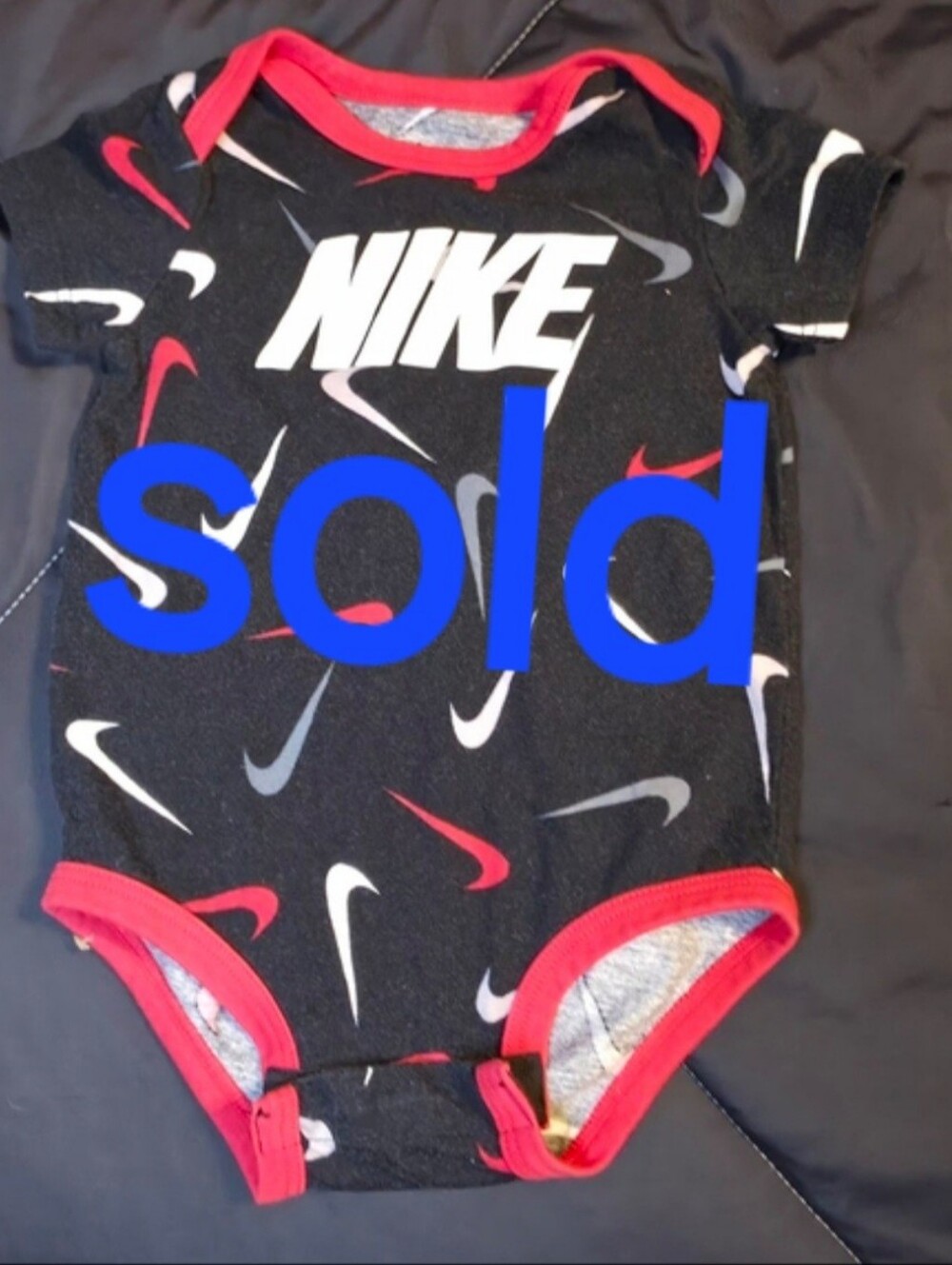 Nike Black & Red Swoosh Print Baby One-Piece